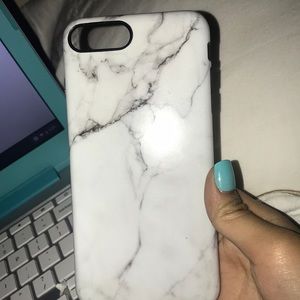 A marble looking extravagant white and black case